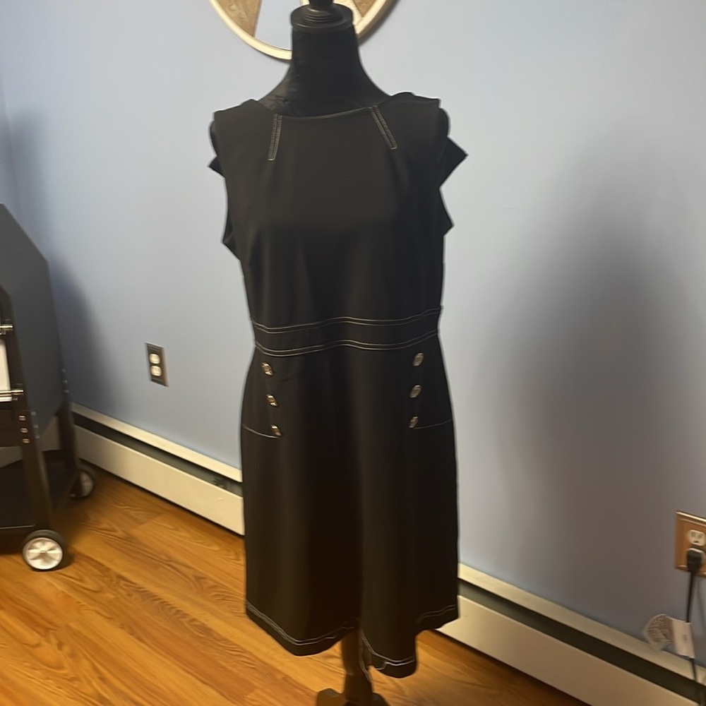 Black dress white trim like new. Size 12